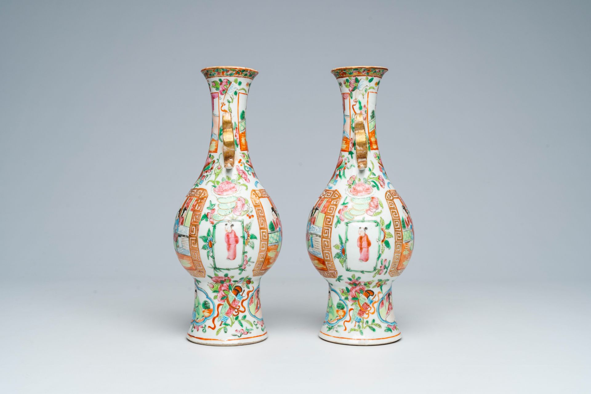 A pair of Chinese Canton famille rose vases and with palace scenes and floral design, 19th C. - Image 2 of 6