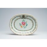 A lobed Chinese famille rose export porcelain armorial charger with floral design, Qianlong