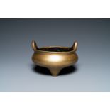 A Chinese bronze tripod censer, Xuande mark, 19th C.