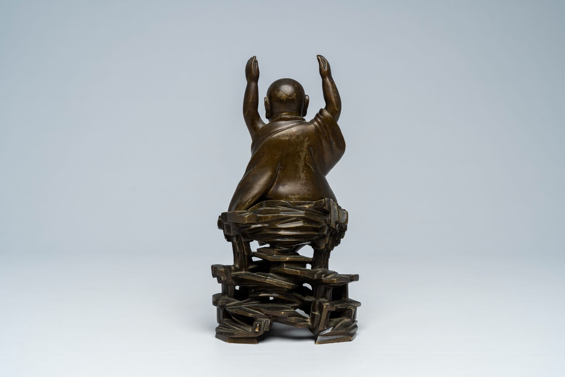 A Vietnamese bronze figure of Buddha seated on a rock, 19th C. - Image 4 of 7