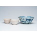 A Chinese blue and white 'Hatcher cargo' bowl and a pair of monochrome white bowls, Ming and later
