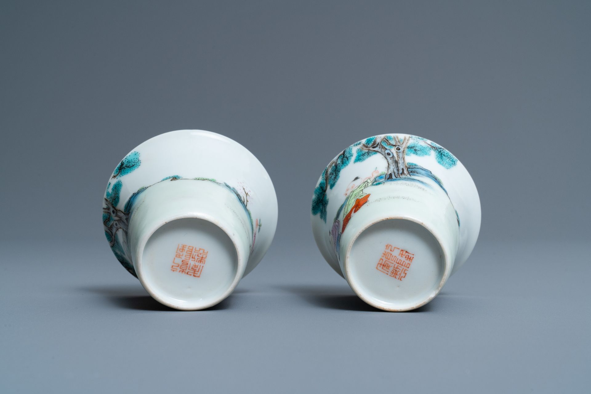 A pair of Chinese famille rose 'playing boys' wine cups, Qianlong mark, Republic, 20th C. - Image 7 of 7