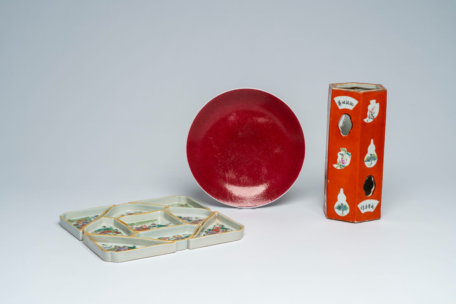 A Chinese famille rose open worked hat stand, a monochrome ruby red plate and a qianjiang cai sweetm