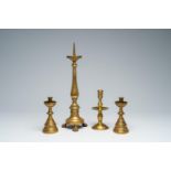 Four various bronze and brass candlesticks, 17th C. and later