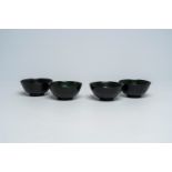 Four Chinese dark green jade bowls, 19th/20th C.