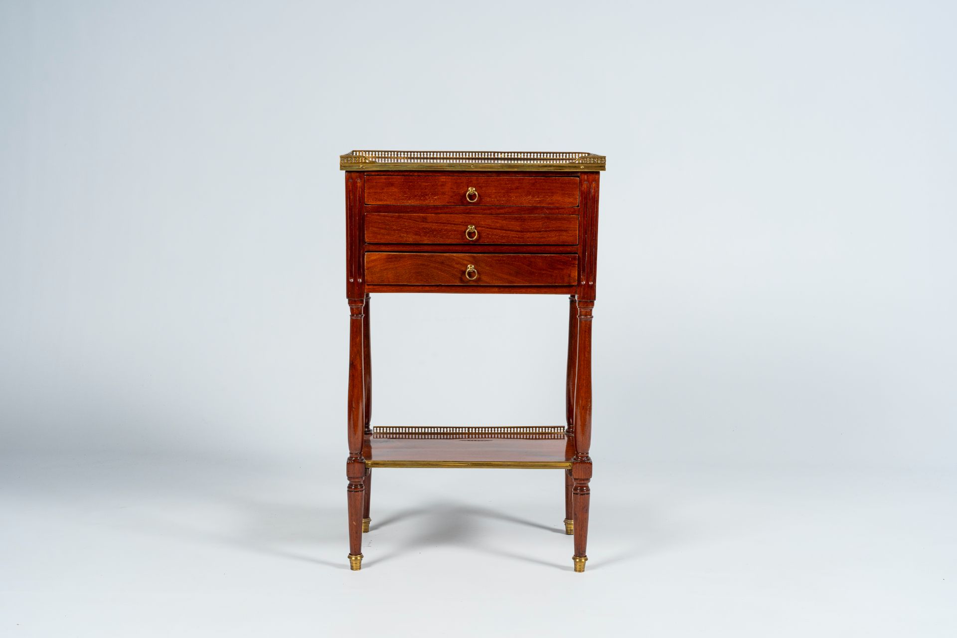 A French mahogany gilt brass mounted side table with three drawers, late 19th C. - Image 3 of 8