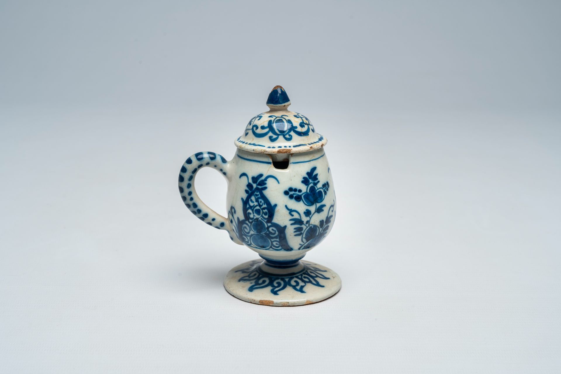 A Dutch Delft blue and white mustard jar and cover, 18th C.