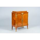 A French Louis XVI style gilt bronze mounted parqueterie two-door side cabinet with brÃ¨che d'Alep m