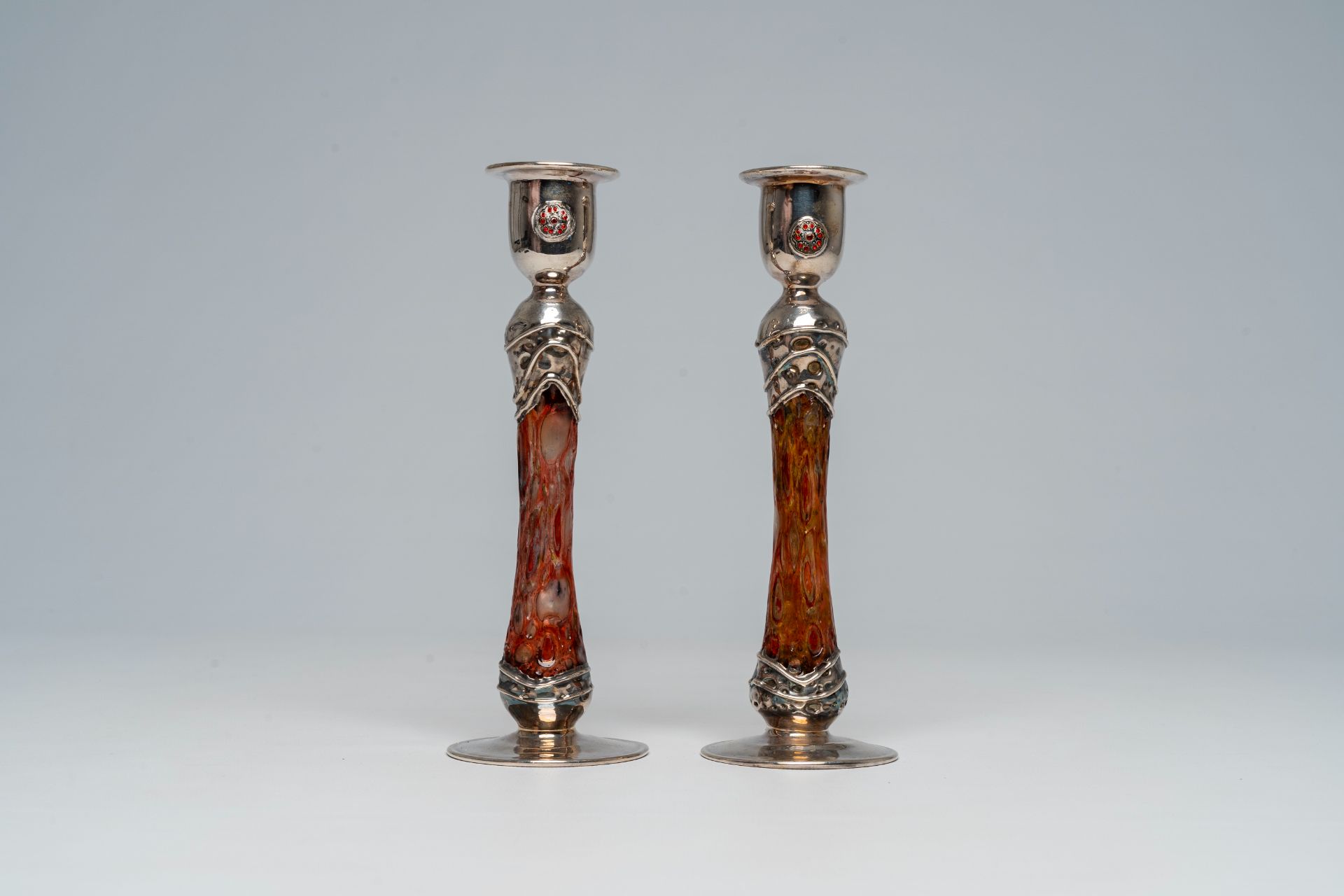A pair of English or Scottish Arts & Crafts style silver and glass candlesticks, 20th C.