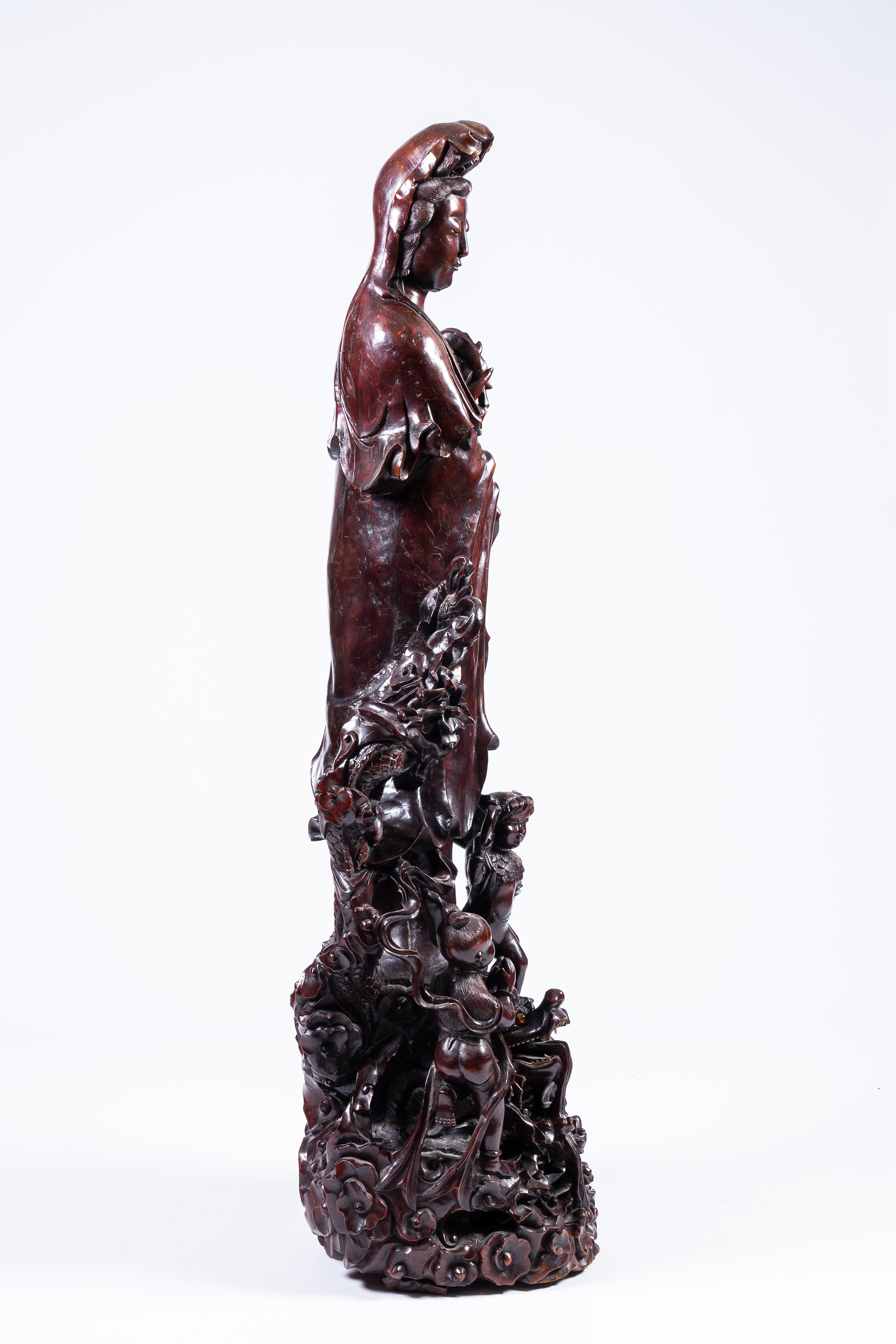 A massive Chinese carved wood group with a Guanyin, children and a dragon, 20th C. - Image 7 of 17