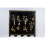 A Chinese four-panel room divider in precious stone-embellished lacquered wood, 20th C.