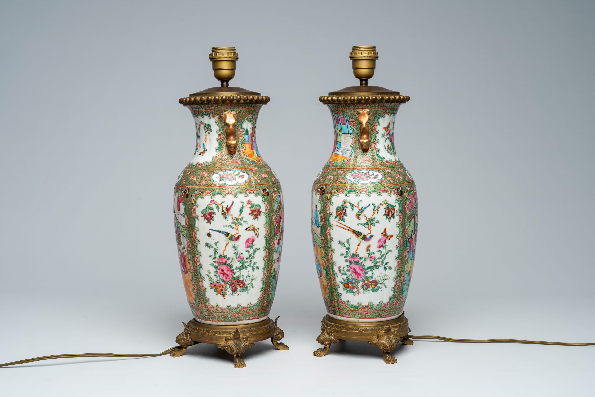 A pair of Chinese Canton famille rose vases with palace scenes mounted as lamps, 19th C. - Image 3 of 7