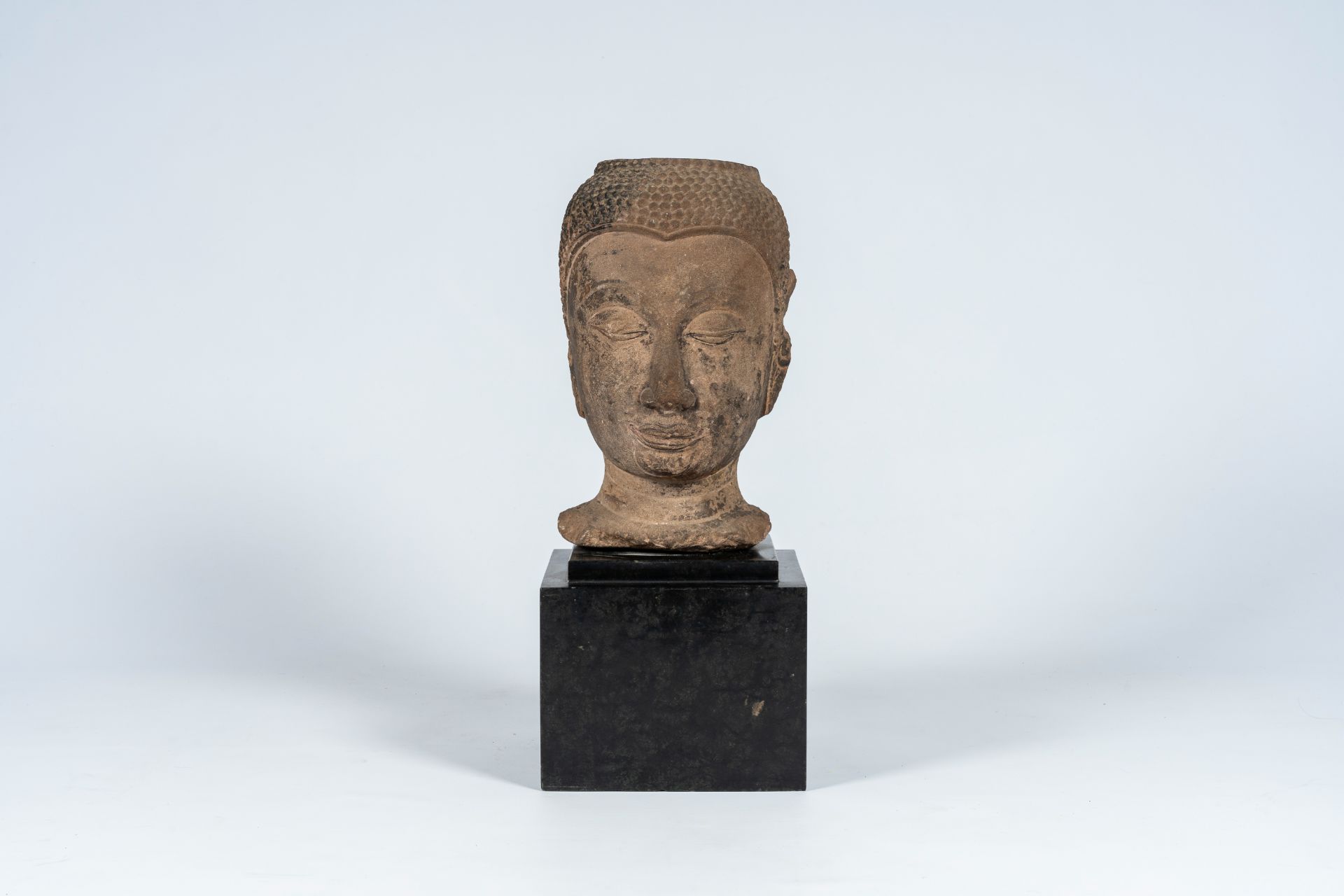 A Thai stone Buddha head, Ayutthaya period, 16th/17th C. - Image 2 of 7