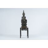 A Thai carved wood Buddha on a Chinese marble-topped wooden stand, 19th/20th C.