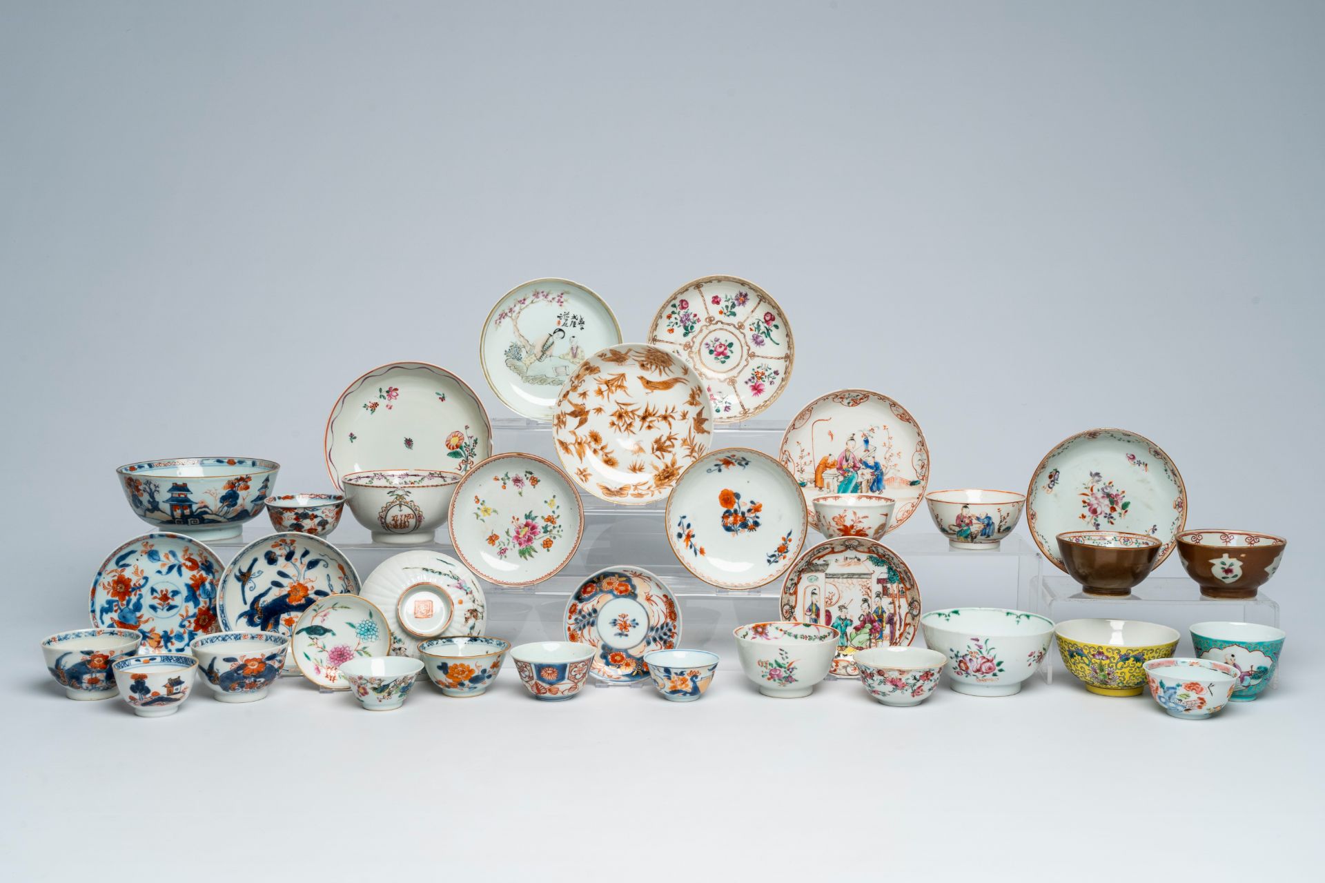 A varied collection of Chinese cups and saucers with various designs, 18th C. and later