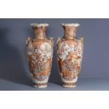 A pair of massive Japanese Satsuma vases with figural design, Meiji, 19th C.