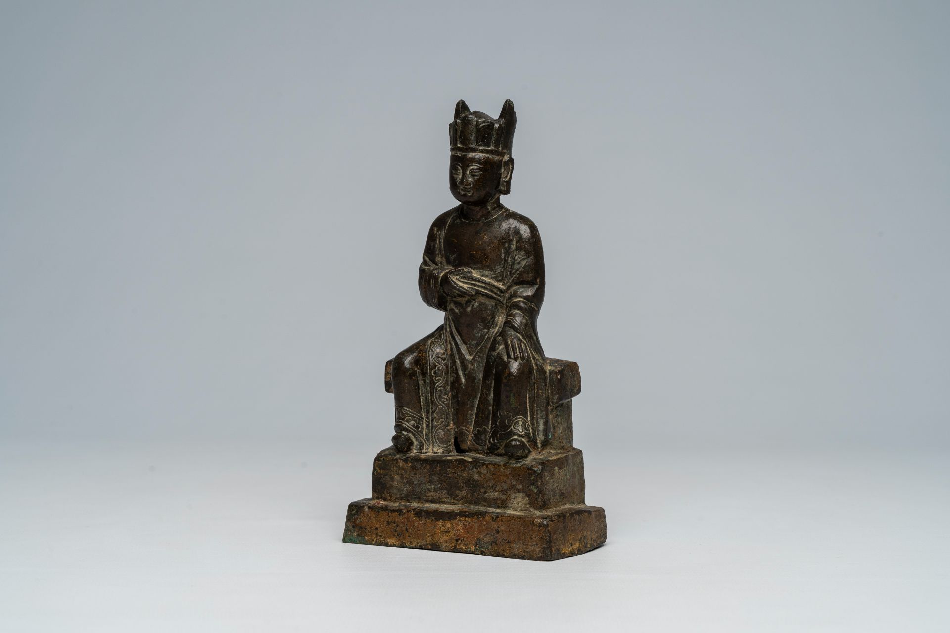 A Chinese bronze figure of a dignitary, Ming