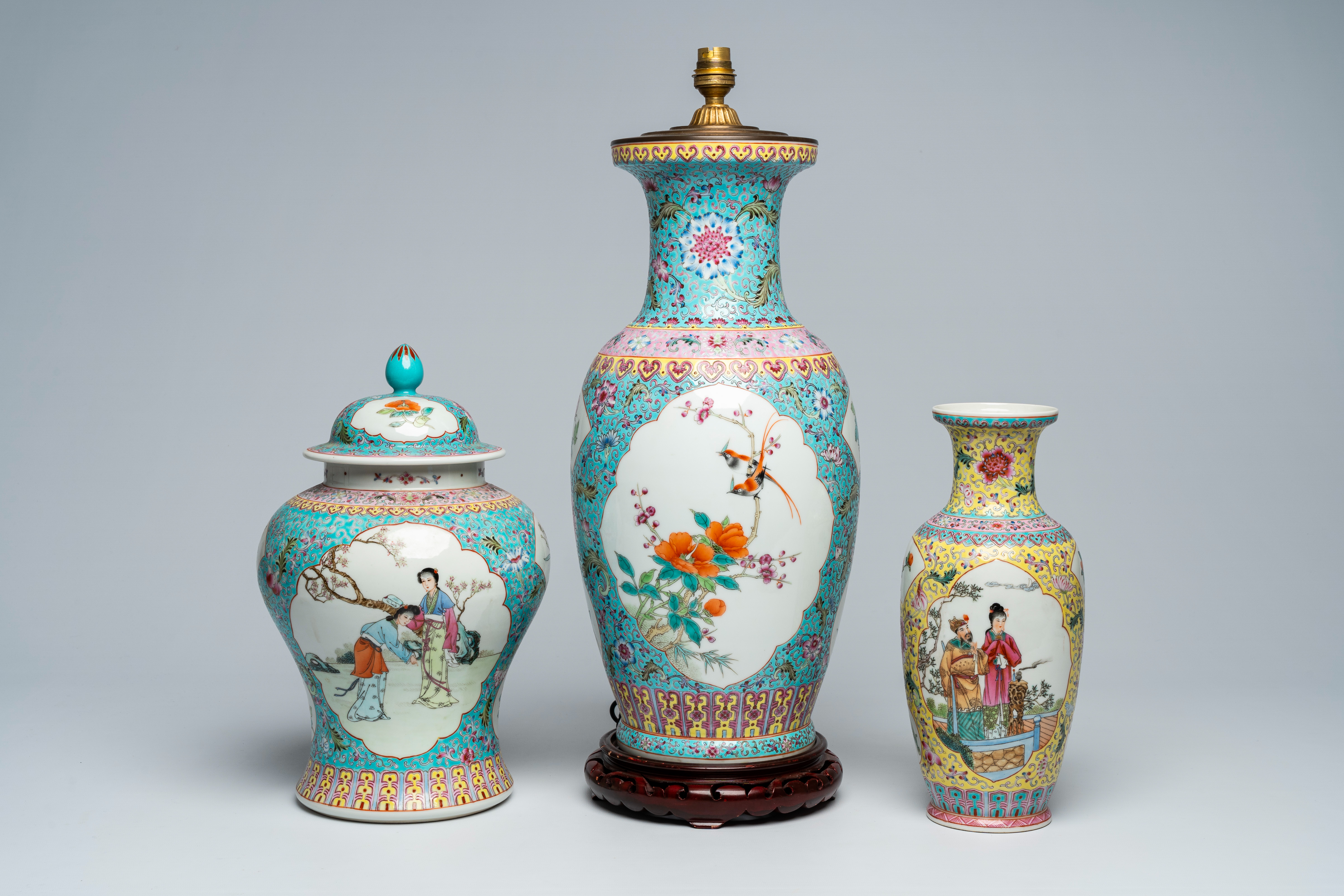 Three various Chinese famille rose vases, one of which mounted as a lamp, 20th C.