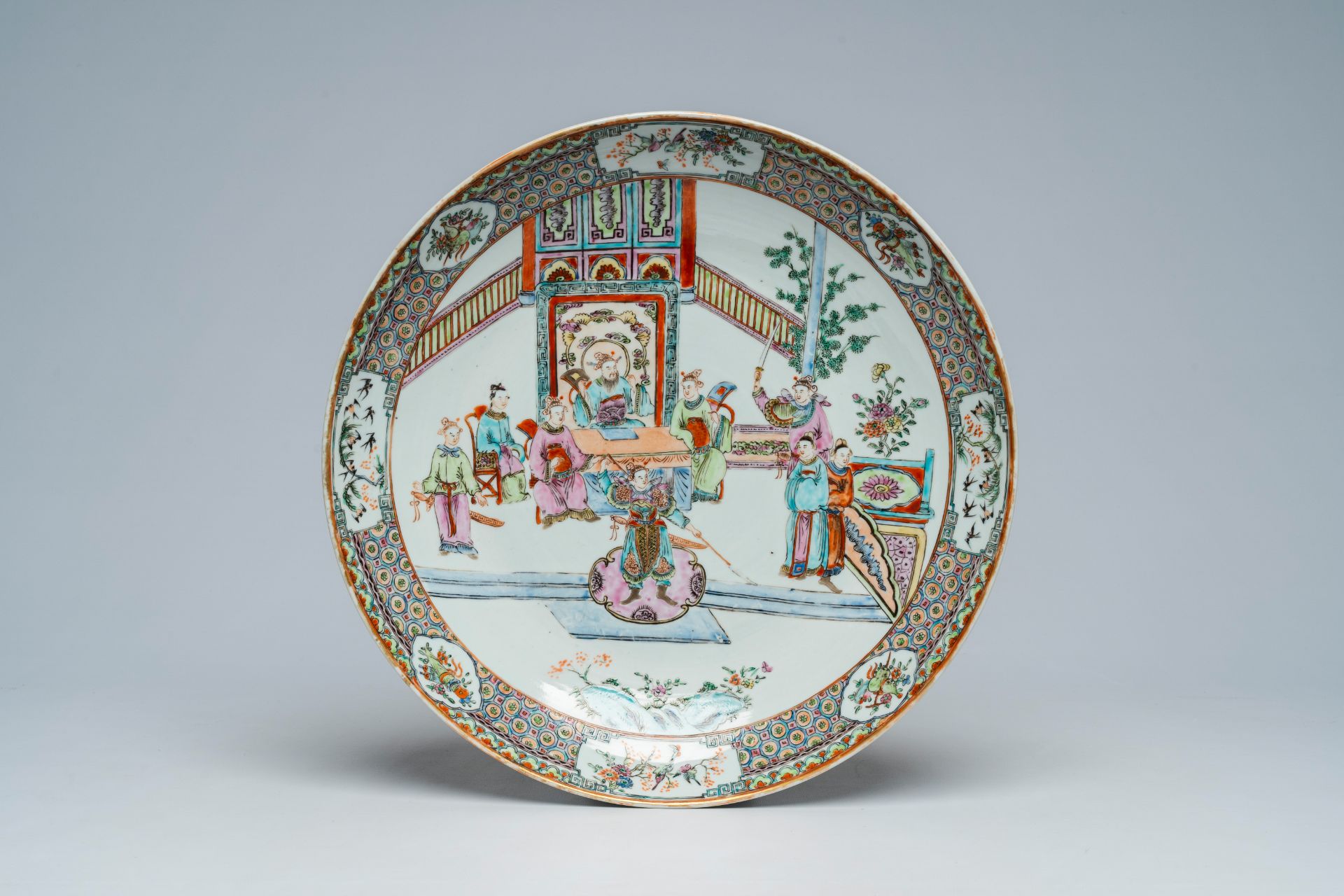 A Chinese Canton famille rose dish with a palace scene, Xuande mark, 19th C.