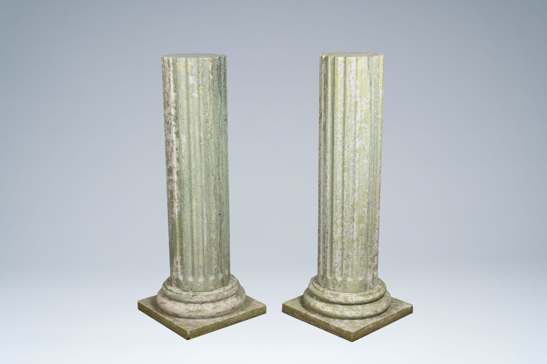 A pair of light green natural stone fluted columns, 20th C.