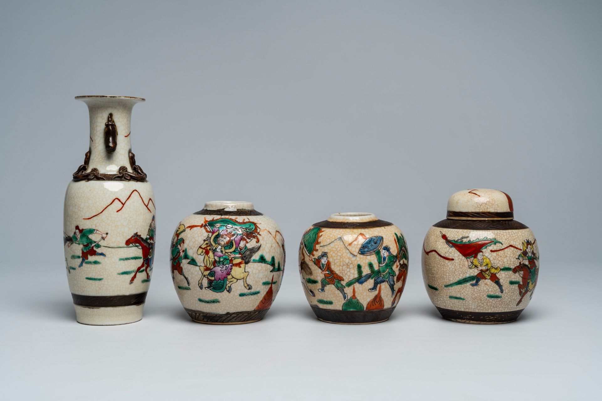 A varied collection of Chinese Nanking crackle glazed famille rose and verte vases and jars with war - Image 11 of 13