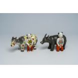 Two Chinese porcelain groups with a buffalo and a donkey with a boy, 19th/20th C.