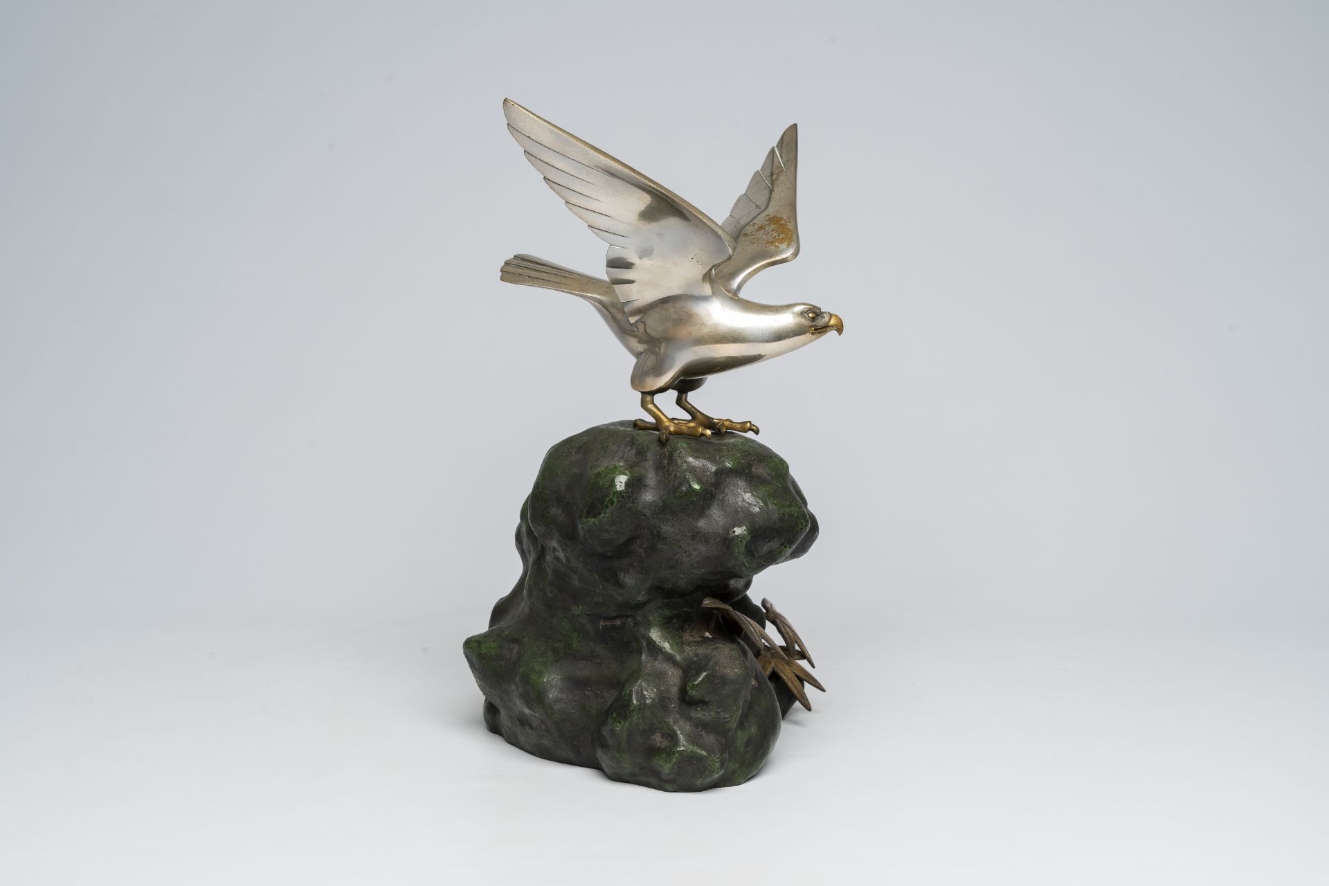 A Japanese patinated and silver-plated metal okimono of an eagle on a rock, signed Hidemasa, 20th C. - Image 5 of 17