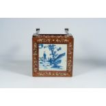 A Chinese mother-of-pearl-inlaid wooden stand with blue and white porcelain top, 19th C.