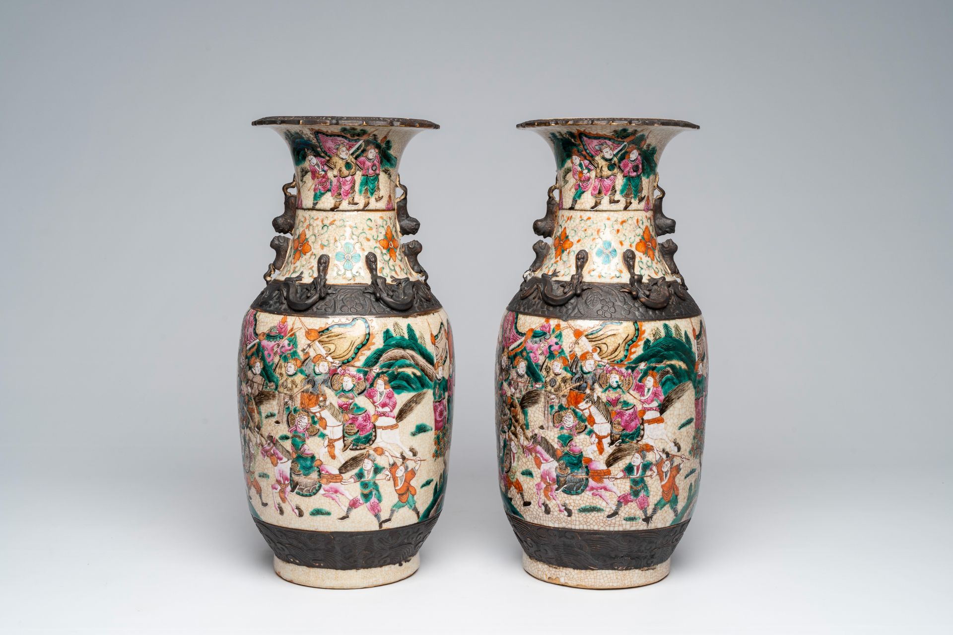 A pair of Chinese Nanking crackle glazed famille rose 'warrior' vases, 19th C.