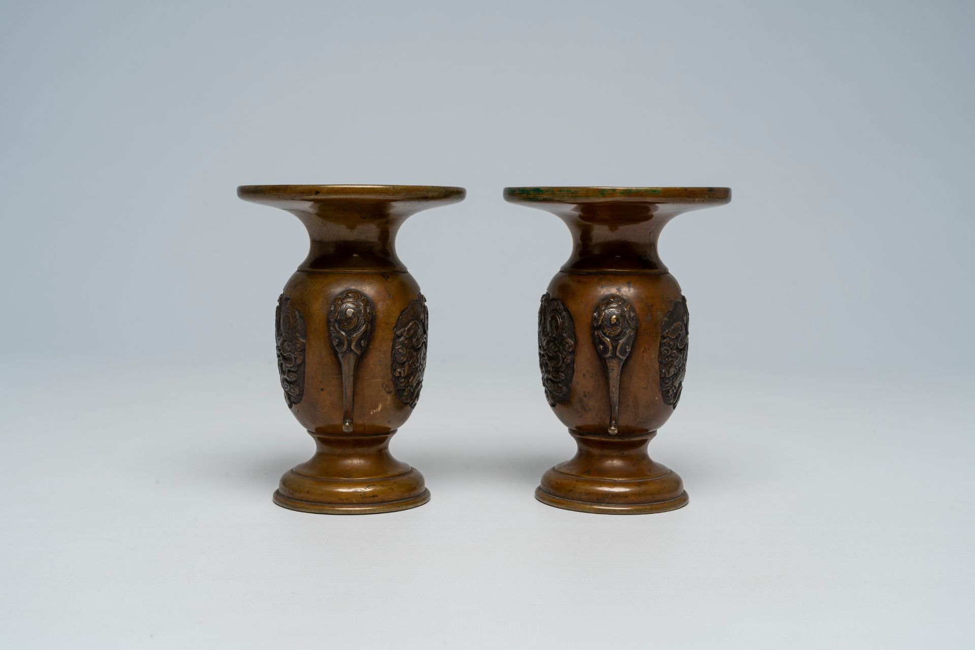 A pair of Japanese bronze vases, two mixed metal chargers with relief design, a blue and white dish - Image 19 of 21