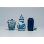 A Chinese blue and white snuff bottle, two covered beakers and a small blue rouleau vase, Kangxi and