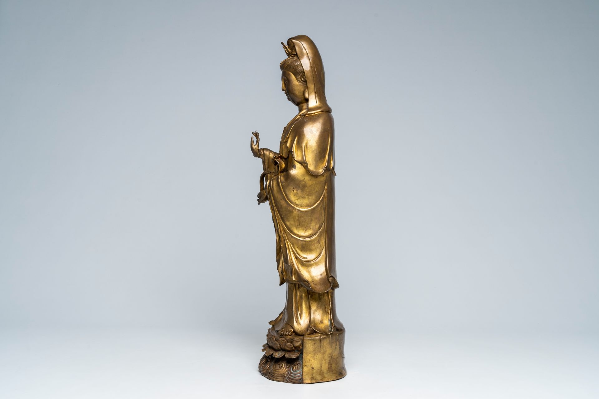 A large Chinese gilt copper sculpture of a standing Guanyin with ruyi sceptre on a lotus throne, Rep - Image 3 of 7