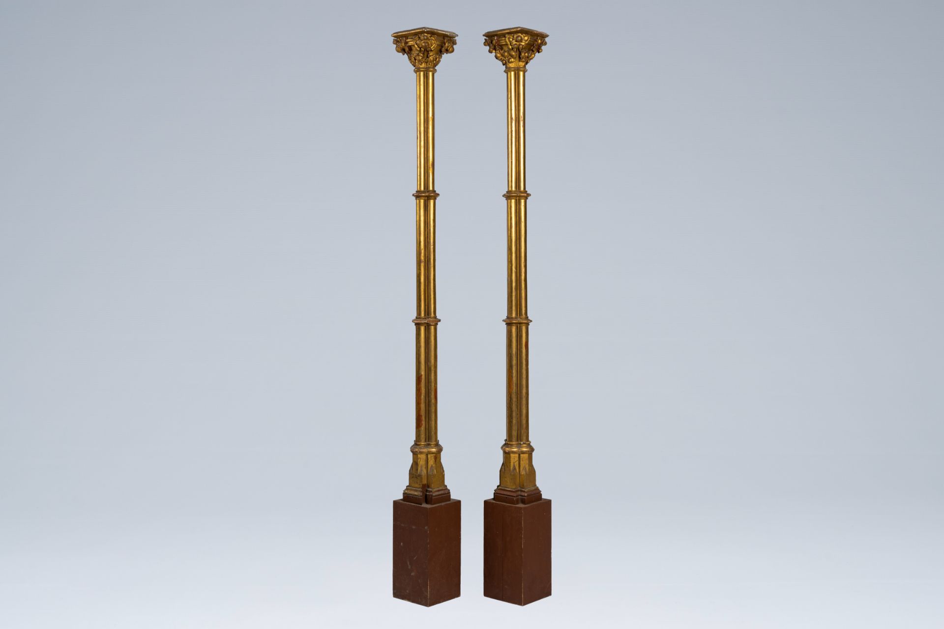 A pair of large Gothic revival gilt wood pillars, 19th C.