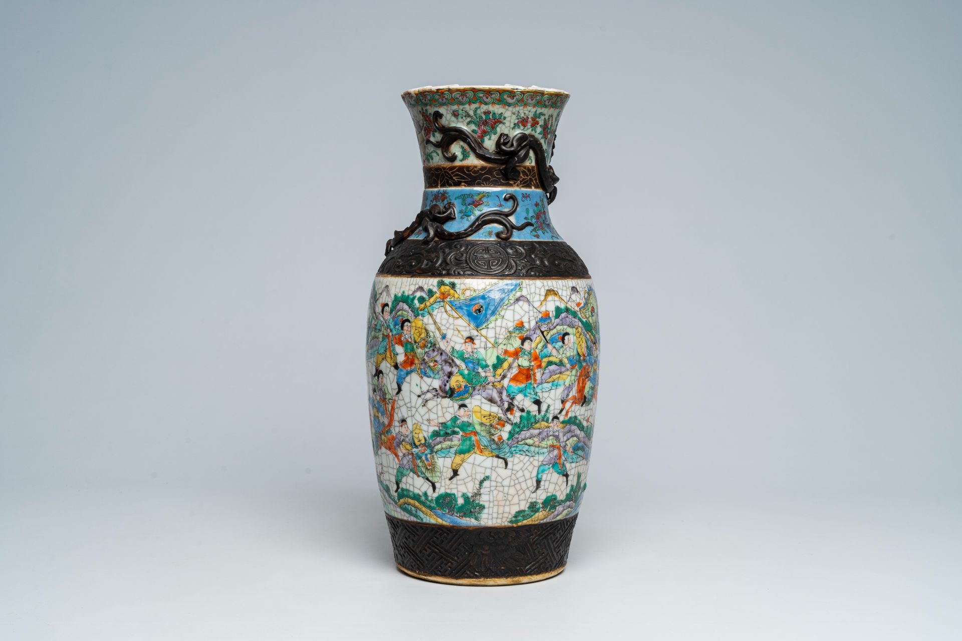 A Chinese Nanking crackle glazed bronze mounted famille rose 'warrior' vase, 19th C. - Image 4 of 7