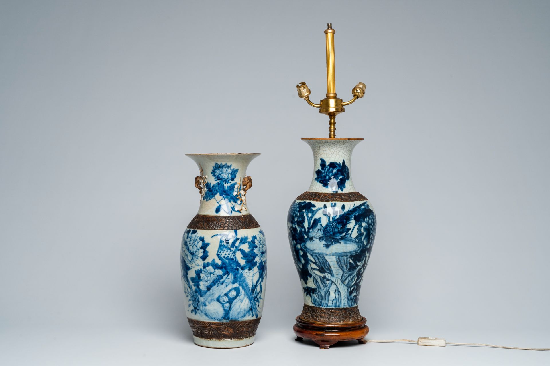 Two Chinese Nanking crackle glazed blue and white vases with birds among blossoming branches, one of