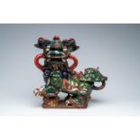 A large Chinese polychrome glazed sculpture of a Buddhist lion, 19th C.