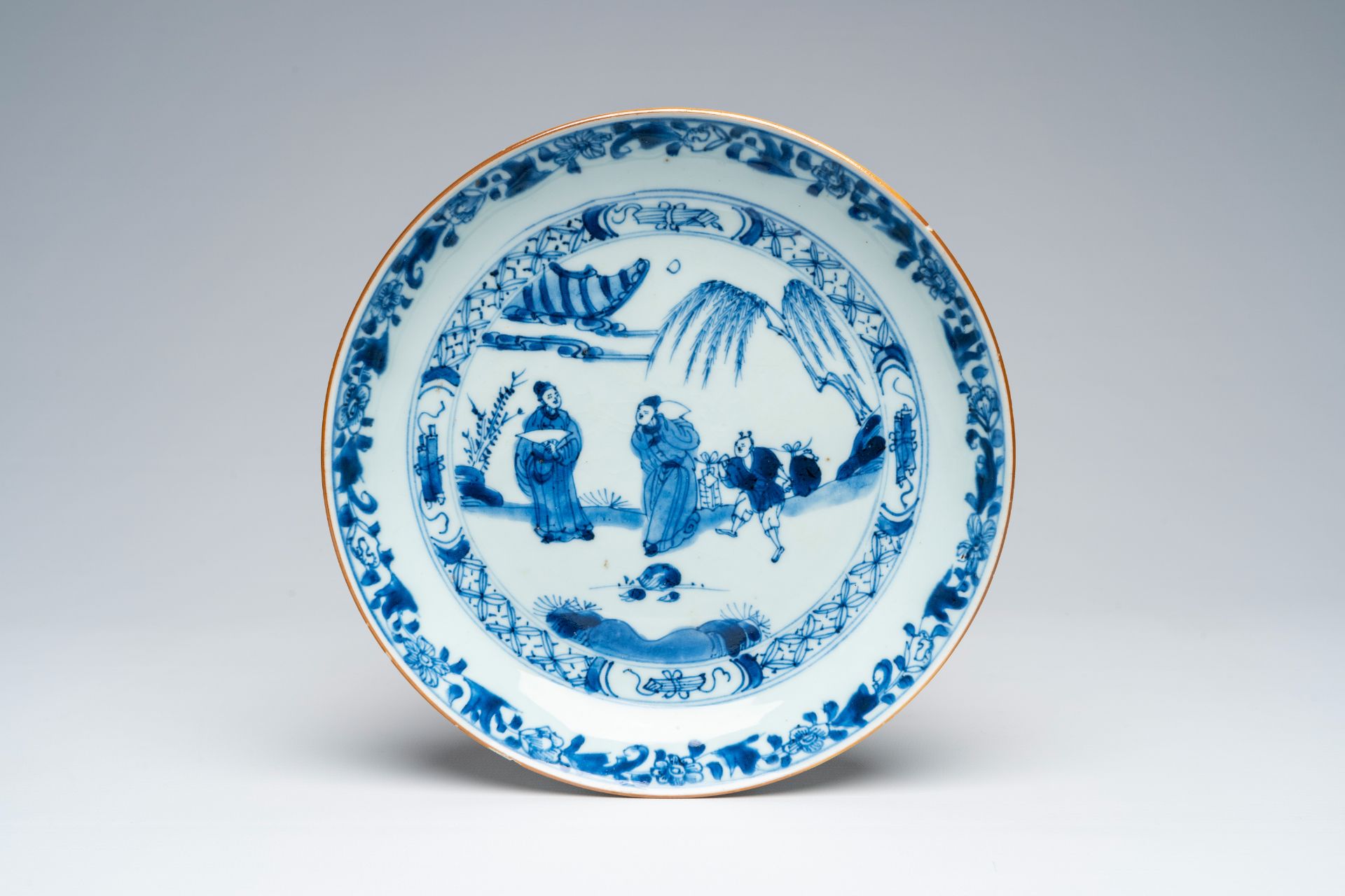 A Chinese blue and white plate with a narrative scene, Yongzheng