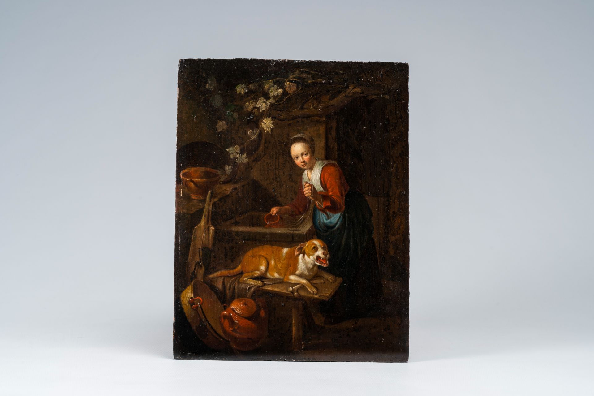 Dutch school: Kitchen maid with her dog at the well, oil on panel, 17th C. - Image 2 of 4