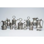 A varied collection of pewter jugs and flagons, a.o. acorn jugs and Swiss Glocken flagons, various o