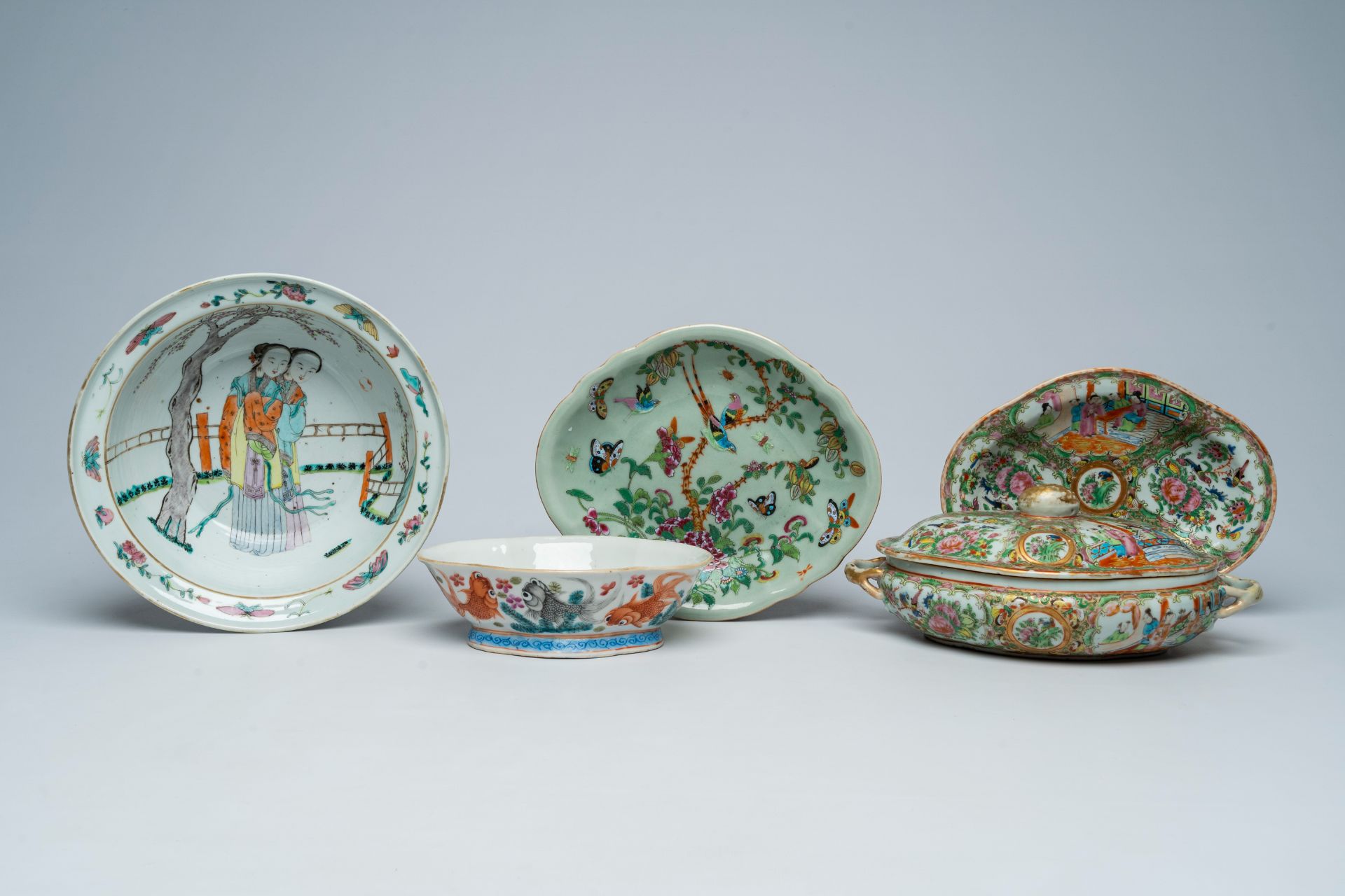 Three various Chinese famille rose bowls and a Canton tureen and cover with palace scenes and floral