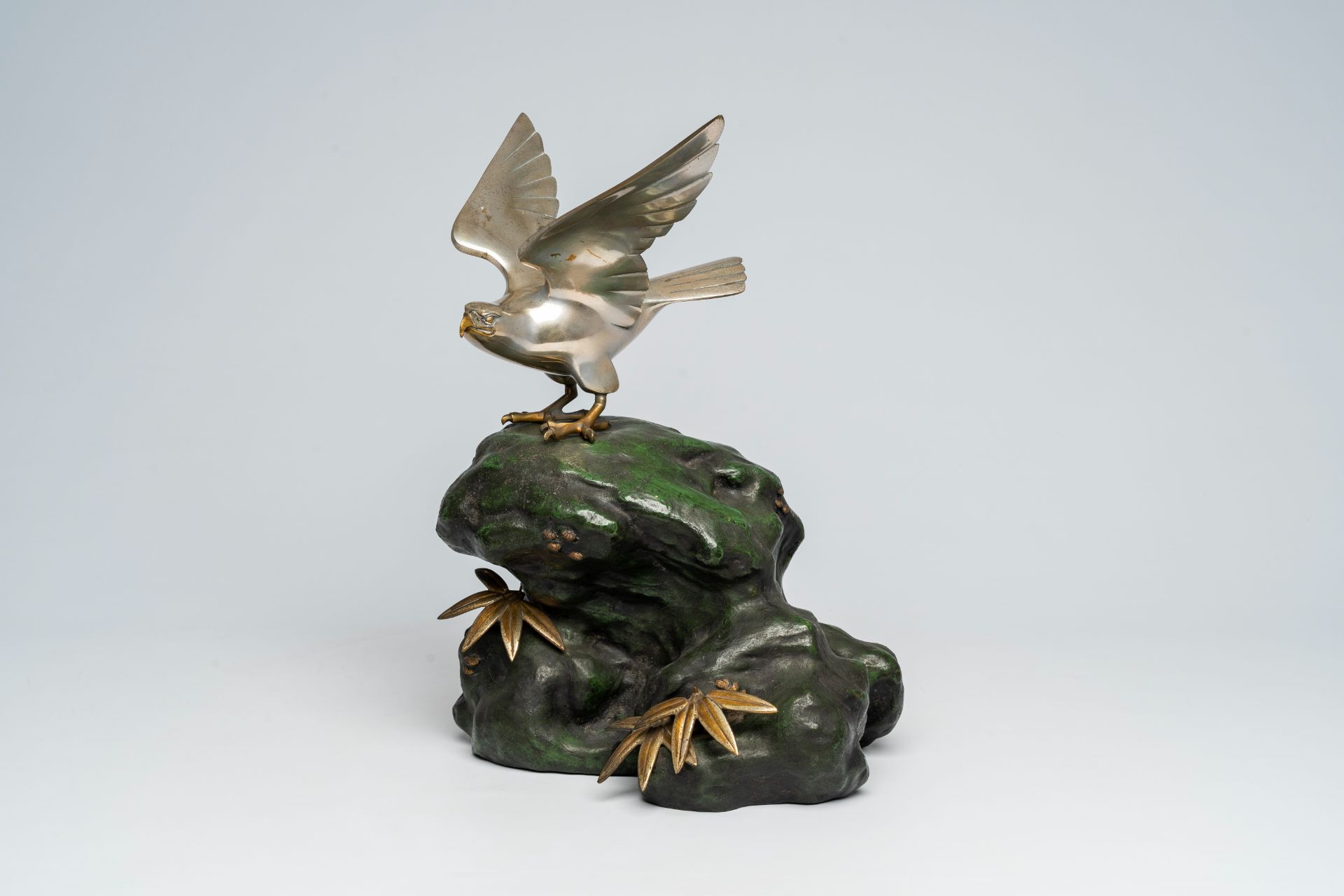 A Japanese patinated and silver-plated metal okimono of an eagle on a rock, signed Hidemasa, 20th C. - Image 9 of 17