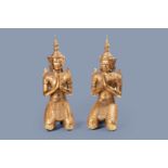 A pair of tall inlaid gilt wood figures of a kneeling Buddha, Thailand, 20th C.