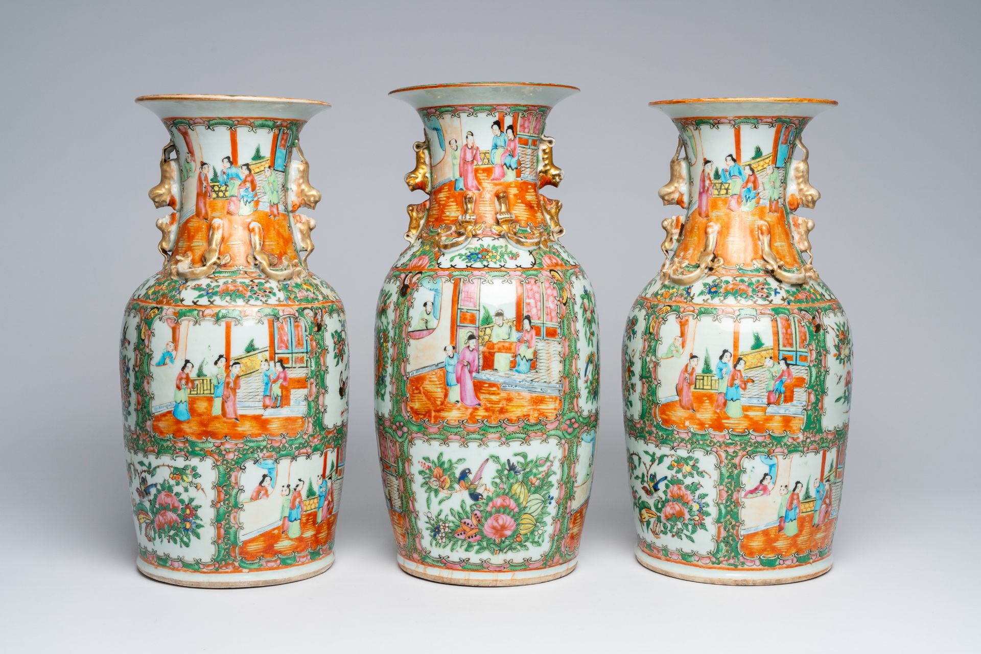 Three Chinese Canton famille rose vases with palace scenes and floral design, ca. 1900