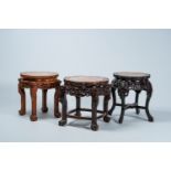 Three Chinese open worked lobed carved wood stands with marble top, 19th/20th C.