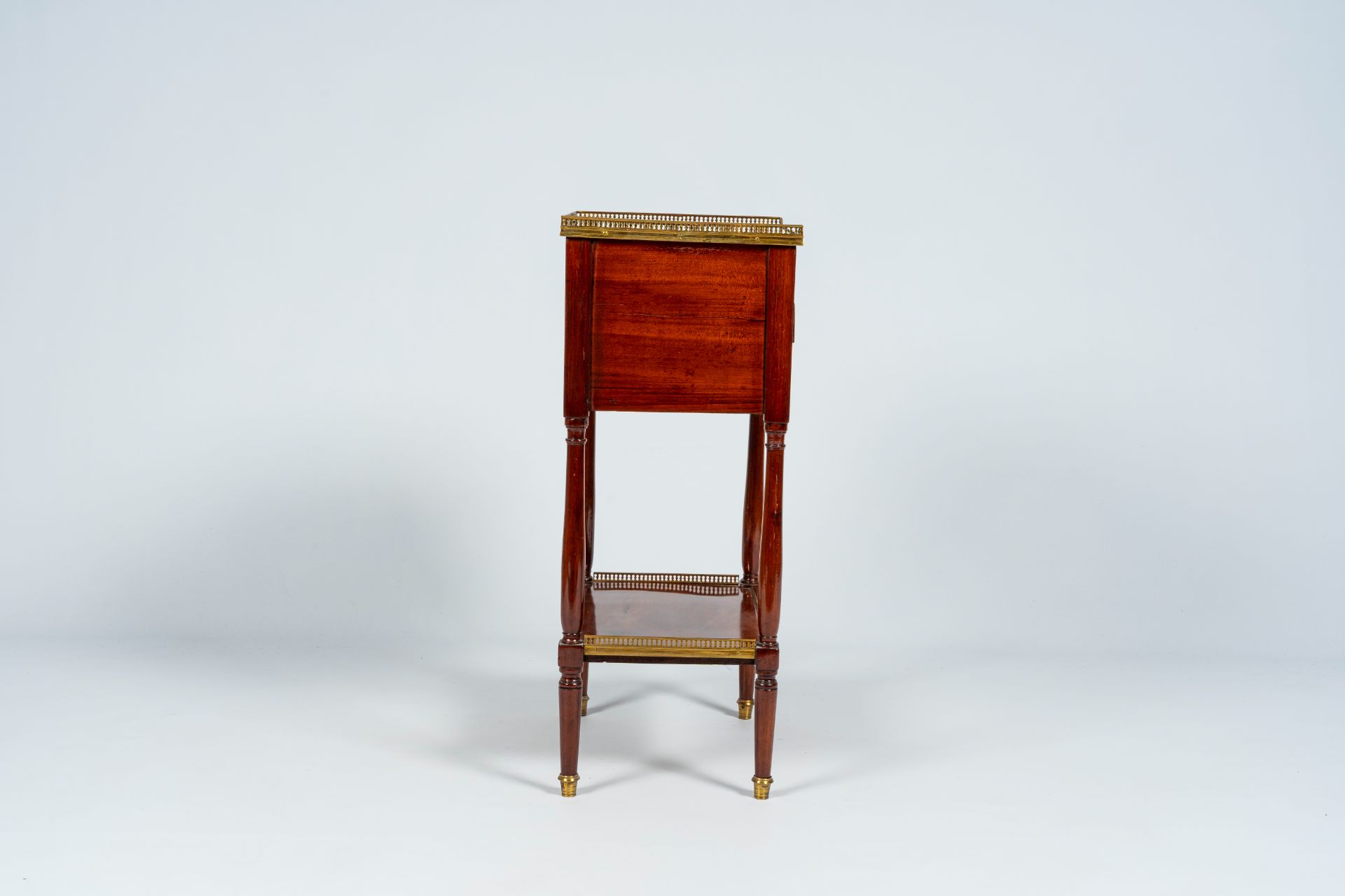 A French mahogany gilt brass mounted side table with three drawers, late 19th C. - Image 6 of 8