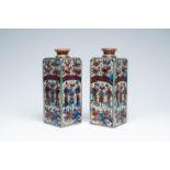 A pair of square Chinese clobbered blue and white bottles with 'Long Elizas', Kangxi