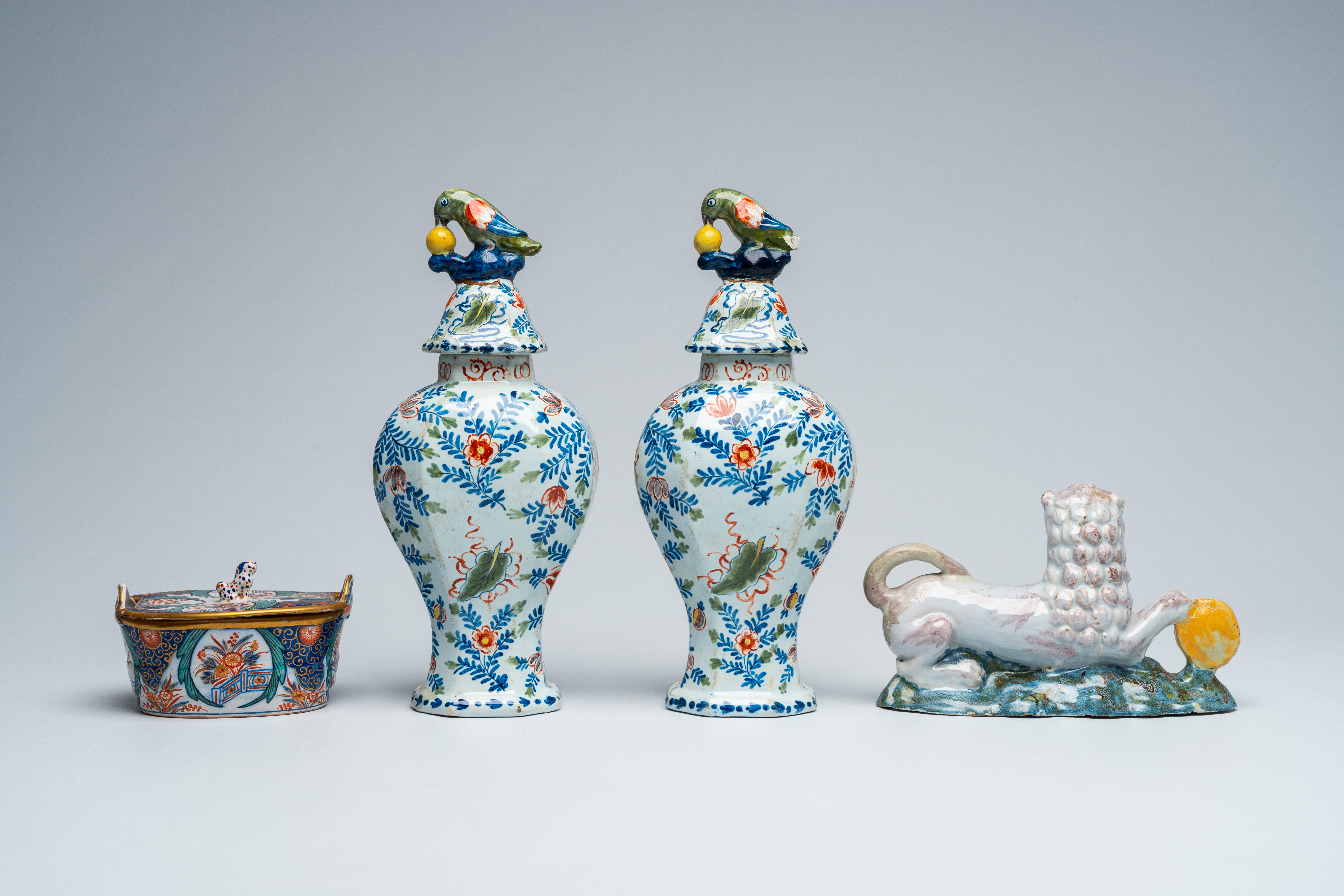 A pair of polychrome Delft vases and covers, a butter tub and a reclining lion, 18th and 19th C. - Image 3 of 7