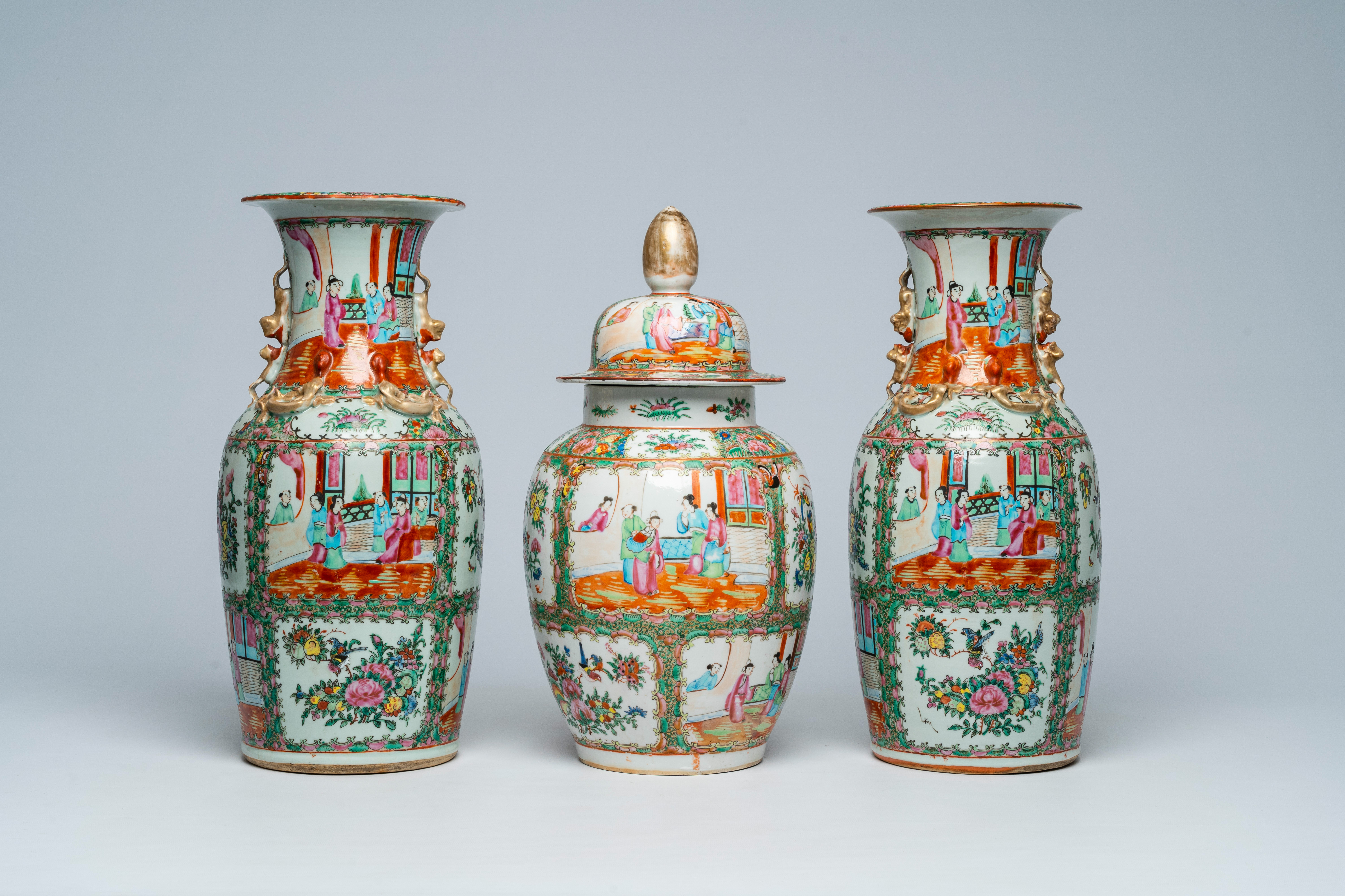 Three Chinese Canton famille rose vases with palace scenes and floral design, 19th C.