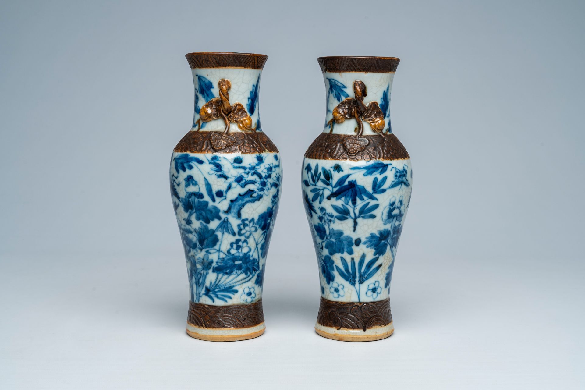 A pair of Chinese Nanking crackle glazed blue and white vases with birds and butterflies among bloss - Image 2 of 6