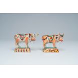 A pair of polychrome petit feu Dutch Delft cows, 18th C.